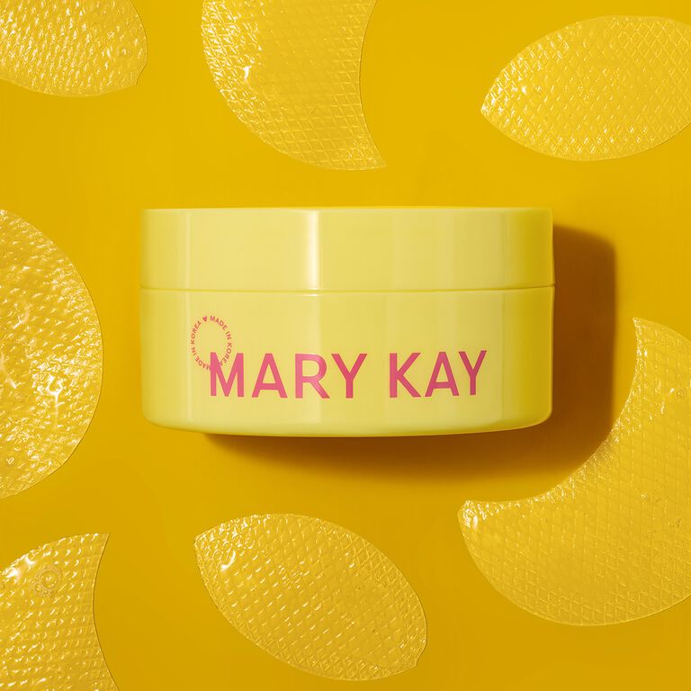 Parches Faciales con Gel de Caracol Mary Kay&reg; de Edici&oacute;n Especial sobre un fondo amarillo rodeado de parches