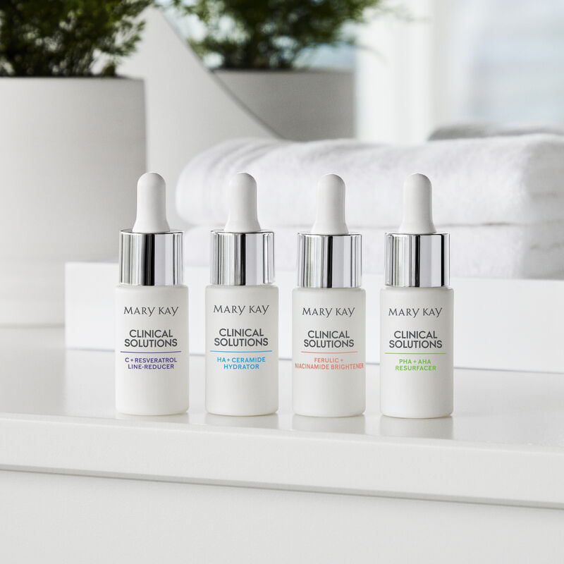 All four Mary Kay Clinical Solutions Boosters in bathroom setting
