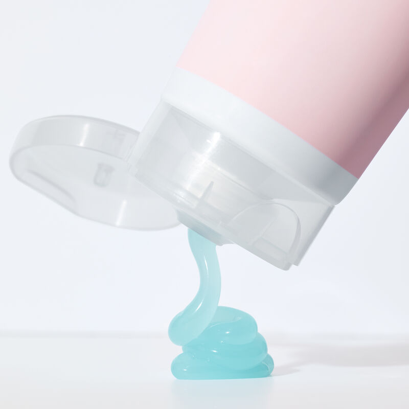 Blue gel product squeezing out of bottle of Mary Kay&reg; After-Sun Replenishing Gel