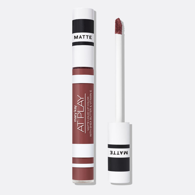 Closed tube of Mary Kay At Play Matte Liquid Lip Color in shade Call Me Rose next to accompanying applicator