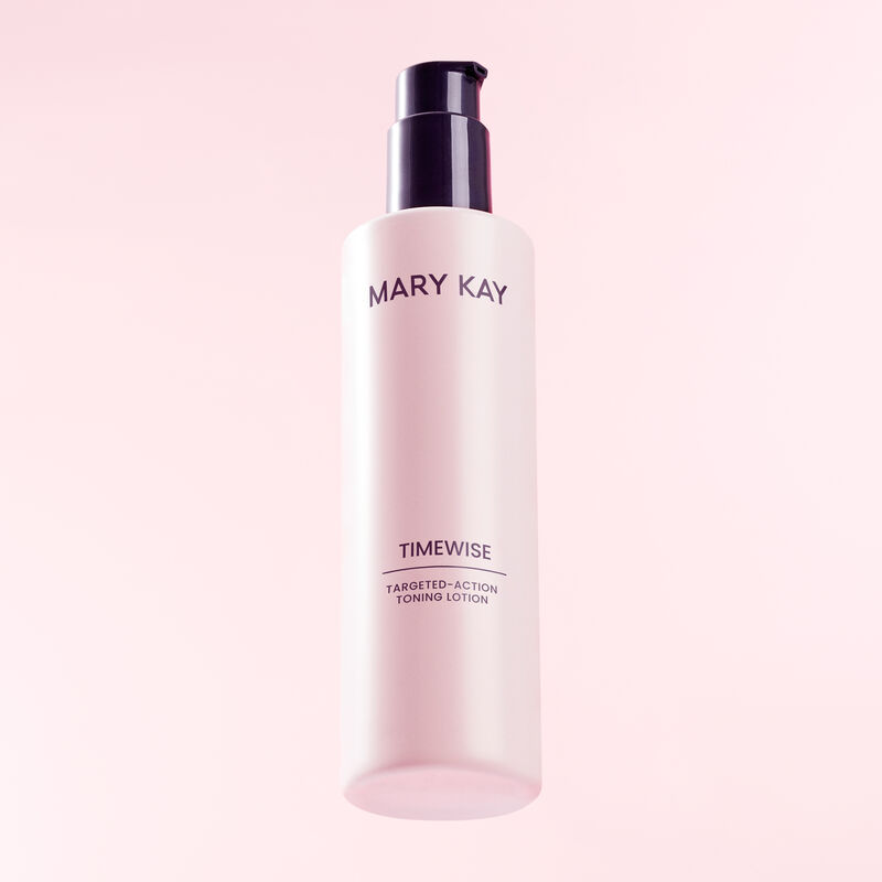 Bottle of TimeWise Targeted-Action Toning Lotion standing heroically against pink background