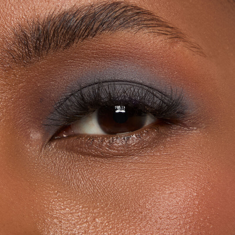 Macro eye shot of Mary Kay Matte Eye Shadow Stick in Moonshadow on deep skin tone