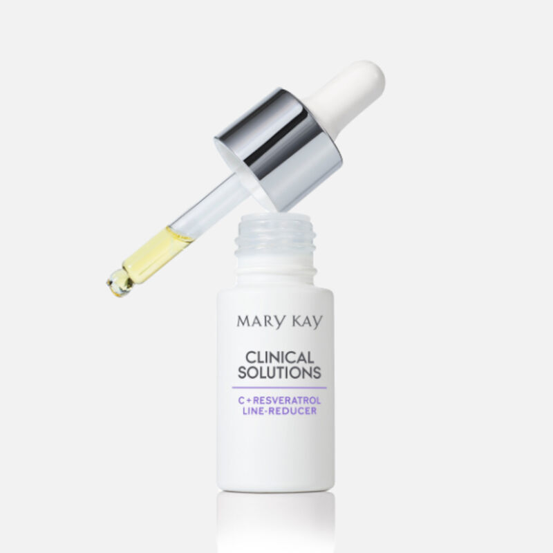 Open bottle of Mary Kay Clinical Solutions C + Resveratrol Line-Reducer with filled dropper