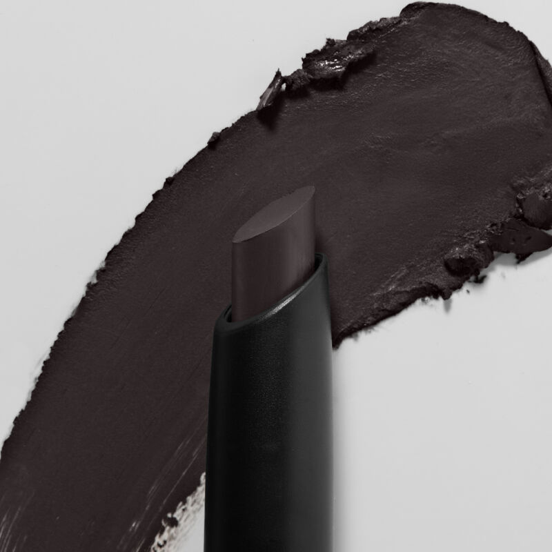 Mary Kay MattenbspEye Shadow Stick in Black Obsidian slanted tip in foreground swatch in backgroundnbsp