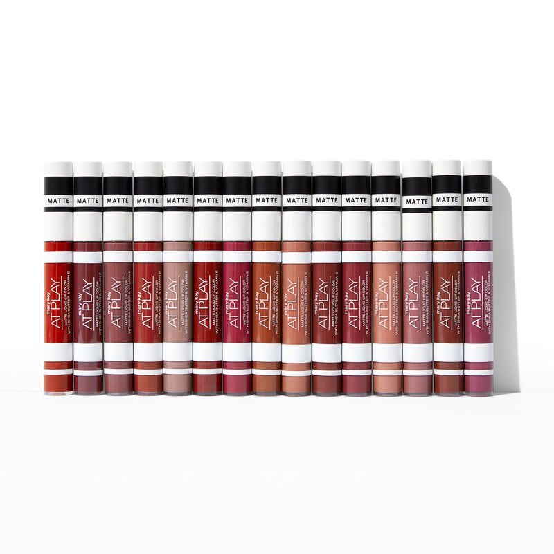 Closed tubes of Mary Kay At Play Matte Liquid Lip Color in all shades standing against plain background