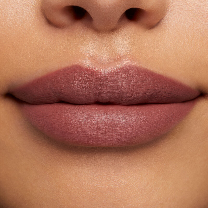 Close-up of lips with medium skin tone wearing Mary Kay At Play Matte Liquid Lip Color in shade Call Me Rose