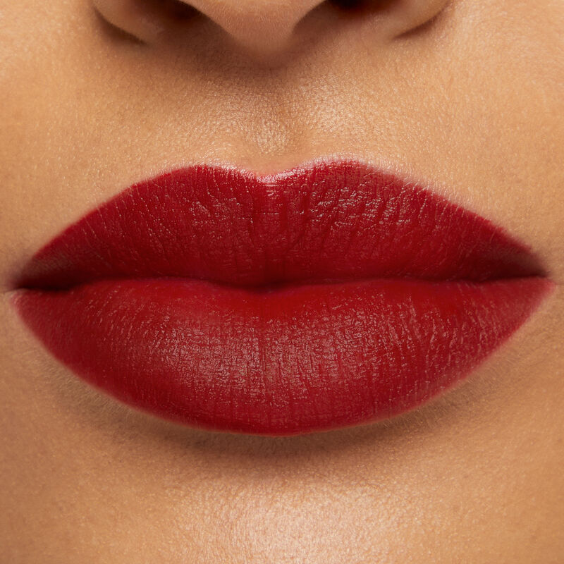 Close-up of lips with medium skin tone wearing Mary Kay At Play Matte Liquid Lip Color in shade Red My Mind