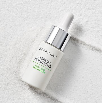 Concentrado PHA + AHA Exfoliante Mary Kay Clinical Solutions&reg; sobre fondo blanco texturizado.