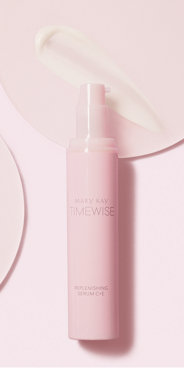 Botella de Loci&oacute;n Facial Regeneradora C+E TimeWise&reg; sobre un fondo rosa con una muestra de producto.